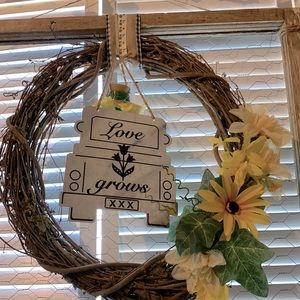 ‘Love Grows’ metal truck sign